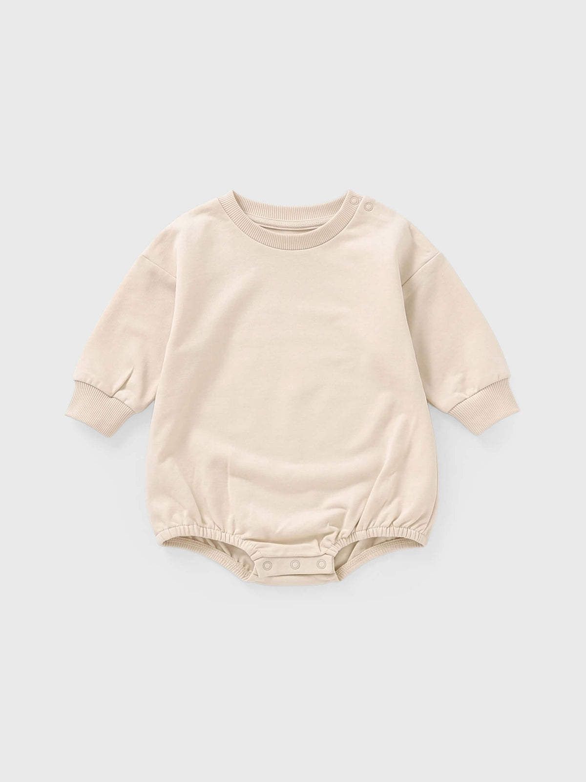 Cream baby bodysuit on a light gray background