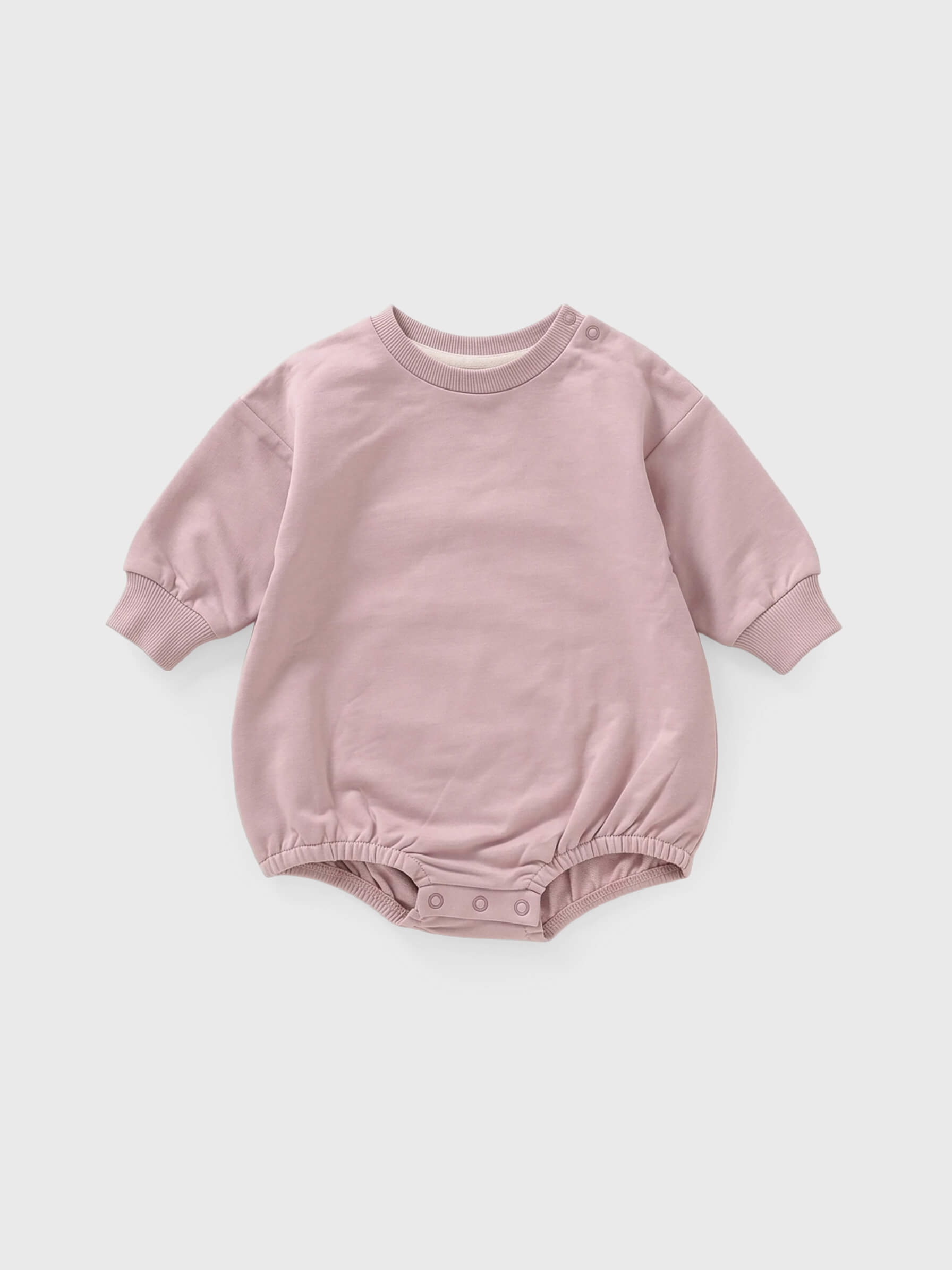 Pink baby romper on a white background
